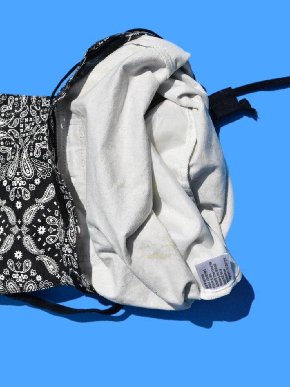 Mini canvas backpack featuring a bold black-and-white bandana/paisley print. Per - Picture 6 of 6